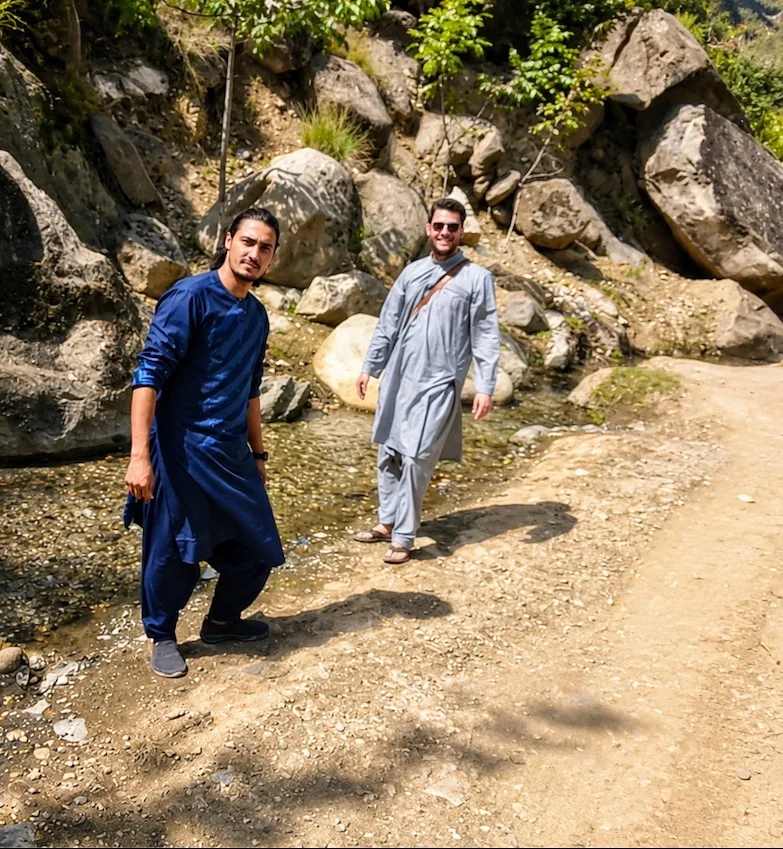 Afghan guide and traveler during a countryside stop